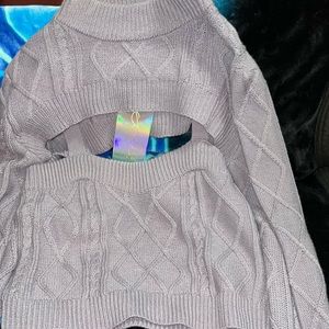 Its a 2 piece turtleneck/ cami. Its more of a lavender color though than purple